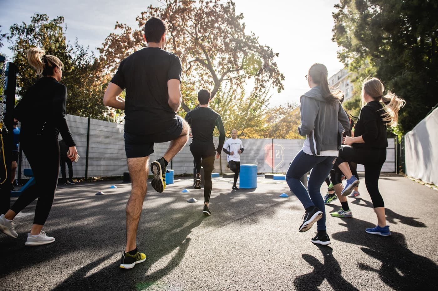 Coach working alongside a client during a training session